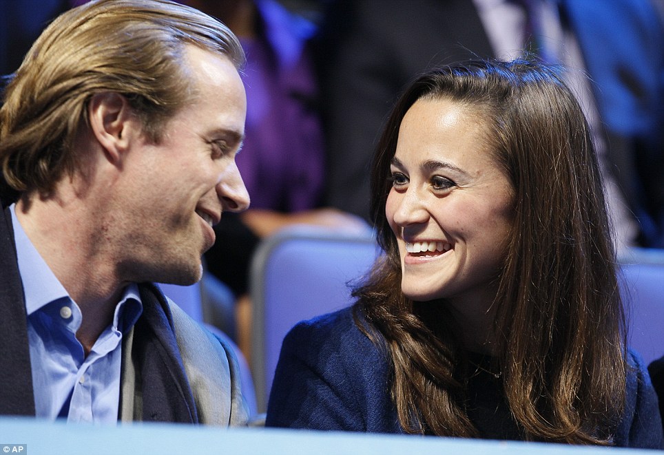 Mystery companion: Pippa shares a moment with a friend at the ATP World Tour tennis tournament at the O2 arena